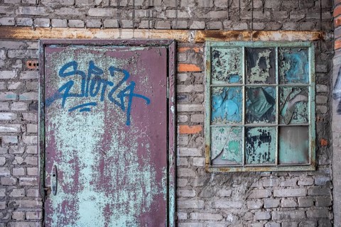 Dilapidated facades on the old shipyard site in Gdansk