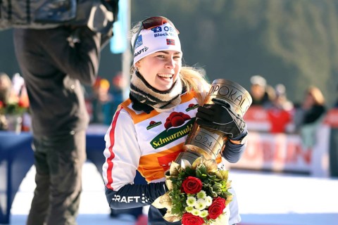 Ida Marie Hagen Norway lifts the Black Forest Cup at the award ceremony for the FIS Nordic Combined