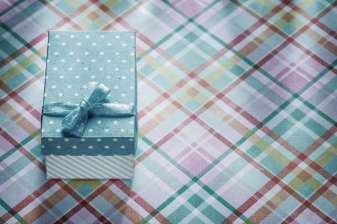 Gift box on checked fabric celebrations concept