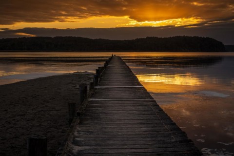 Sunset over the Jasmunder Bodden coast, with the pier in Lietzow, Mecklenburg-Western Pomerania,