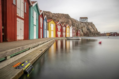 Small colourful houses by the sea. Typical houses in Sweden for the coastal landscape. Crab fishing