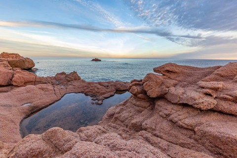 Coastal landscape with bizarre red rocks and sea view, Spiaggia di Cala E'Luas, Ogliastra,
