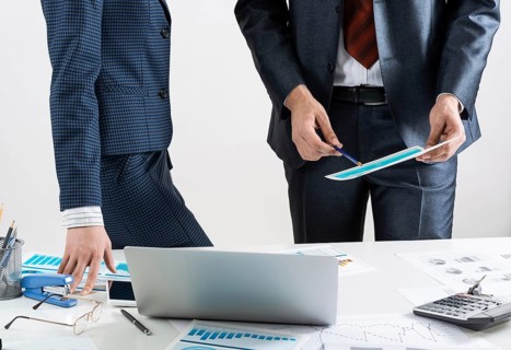 Business partnership concept with business people. Office desk with financial analytics. Business