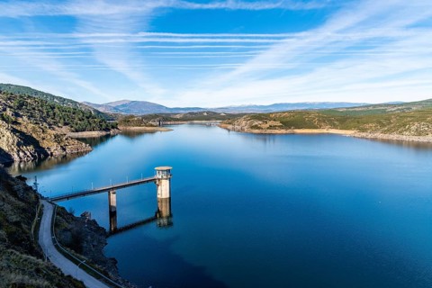 The Atazar reservoir and control tower of Dam in the mountain range of Madrid