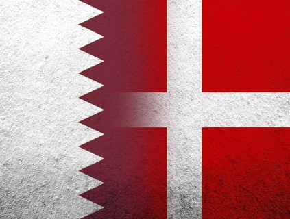 The Kingdom of Denmark National flag with The State of Qatar National flag. Grunge Background