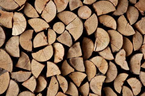Cut firewood stack logs as pattern background