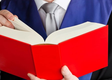 A judge with a law book in court. Jurisdiction and judgments in crime, A judge with a law book in