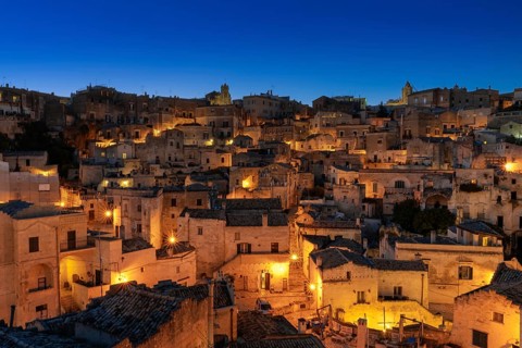 Matera, Italy, 26 November, 2023: view of the old town of Matera after sunset with the lights