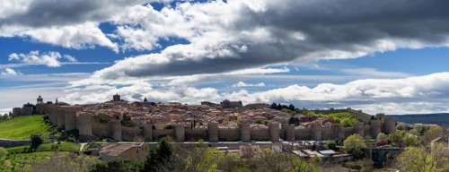 Avila, Spain, 8 April, 2024: panorama view of the medieval walled city of Avila on a beautiful