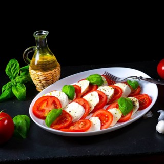 Tomatoes with mozzarella and basil
