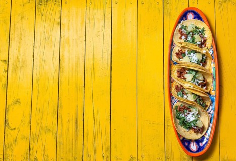 Food, Food, Mexican background with tacos al pastor and mexican sauces. Yellow wooden background,