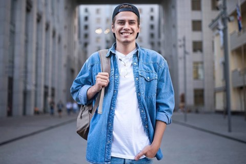 Background on the street while waiting his colleagues. Businessman wearing casual white shirt and
