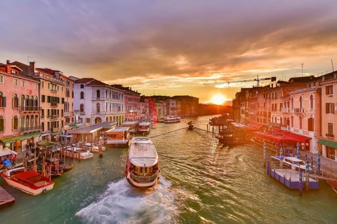 The Grand Canal with gondola and vaporetto at sunset time, Venice, Italy, Europe
