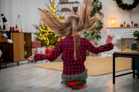 A joyful moment that beautifully captures the festive spirit with a playful young girl celebrating
