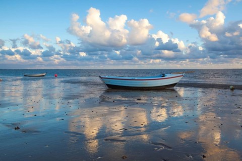 Fishing boats on the empty beach, Hjerting, Jutland, Denmark. Hjerting is a district of Esbjerg in