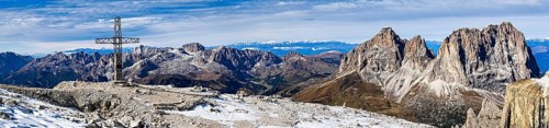 Panoramic photo with summit cross of the Saß Pordoi, in the Dolomites, South Tyrol, Italy, Europe