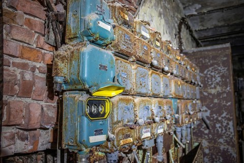 Old abandoned paper factory. Historic and typical factory building as a lost place. Destruction and