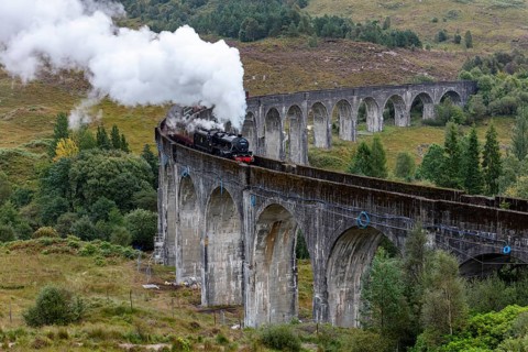 The Jacobite Steam Train, steam railway on the Glenfinnan railway viaduct, known from Harry Potter,