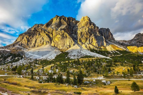 The concept of active and adventure tourism. Peaks rocks spectacularly stands on a background of