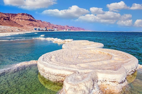 Evaporated salt forms beautiful, symmetrical crystals on the surface of the water. The saltiest