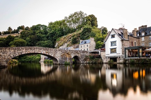 View of the medieval vridge over river Rance and the harbour of the city of Dinan, French Brittany.
