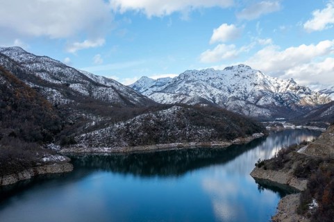 Mounains Lagoon Ancoa in the snow en region Maule, Chile. Aerial drone view