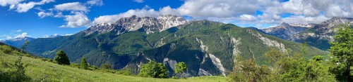 Mountain panorama above Bardonecchia with Pointe Cloutzau and Aiguille Rouge, railway tracks,