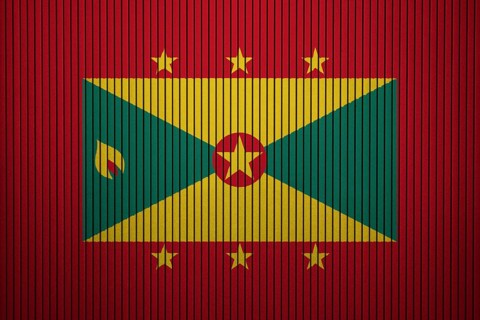 Grenada Flag painted on the cracked grunge concrete wall