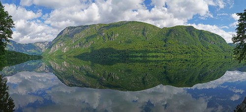 Mountain range reflected in Lake Bohinj, Triglav National Park, Julian Alps, Gorenjska region or