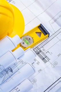Construction level helmet rolled blueprints