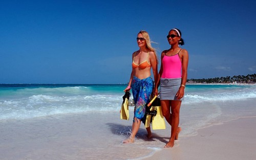 Two snorkellers on the beach, Punta Cana, Caribbean, Dominican Republic, Central America