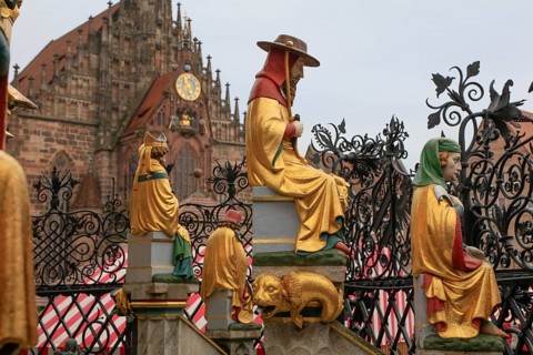 Beautiful fountain on the main market square, tubular fountain with 40 figures from the 14th