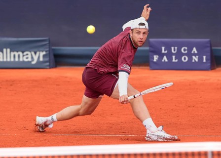 Dutch tennis player Tallon Griekspoor playing a backhand volley at the 2025 BMW Open tournament in