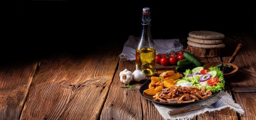 Rustic gyros plate it green salad and potato wedges