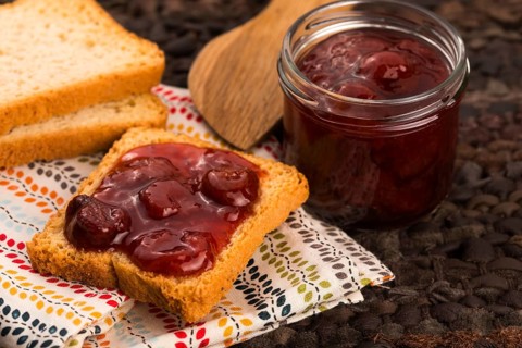 Breakfast of cherry jam on toast