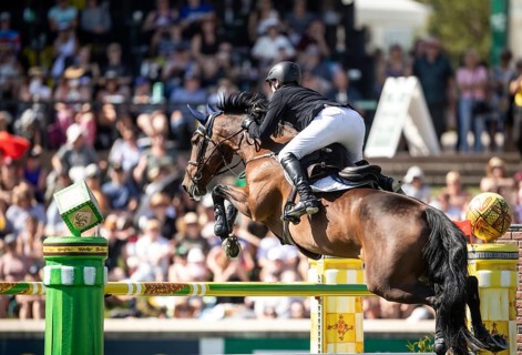Daniel Coyle of Ireland and riding Legacy compete in the first round of the 1.60m CPKC