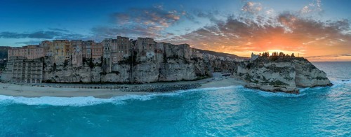 Tropea, Italy, 16 December, 2023: panorama view of Rotonda Beach and the colourful old town of