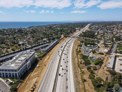 Aerial view of highway transportation with small traffic, highway interchange and junction, San