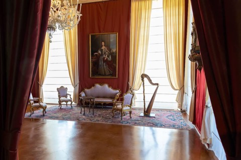Venaria Reale, Italy, February 2023: luxury interior, old Royal Palace. Perspective with harp,