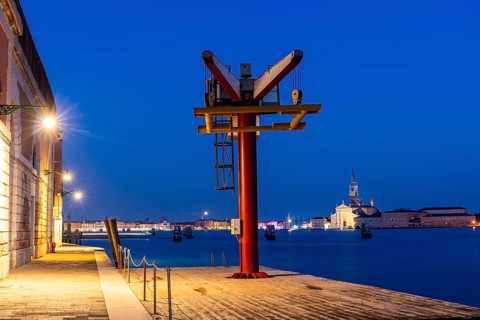 Loading crane on the quay, backlit church of San Giorgio Maggiore, blue hour, Venice, UNESCO World