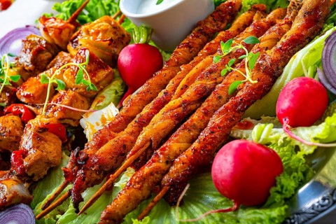 Grilled szaszlyk and meatballs with green salad