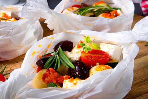 Baked dumplings with courgette, tomatoes and diced sheep's cheese