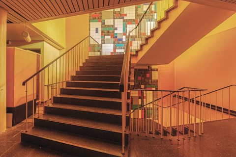 Stairwell with coloured tiles and warm light, Bad am Südpark, Essen-Kray, North Rhine-Westphalia,