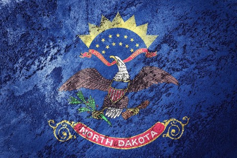 Grunge North Dakota state flag. North Dakota flag background grunge texture