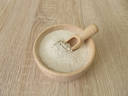 Banana flour made from green plantains in a wooden bowl