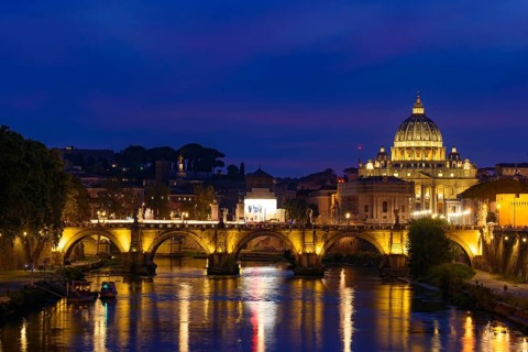 Sunset view of St. Peter's Basilica, Ponte Sant'Angelo, and Tiber River in Rome, Italy, Europe