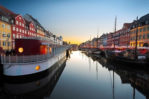 Ships in Nyhavn at sunset, Copenhagen, Denmark, Europe