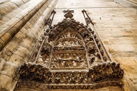 Relief on a religious theme on the wall in the Duomo. Milan, Italy.