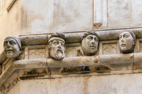 Human heads on the side portal of The Cathedral of St. James, Sibenik, Croatia, Europe