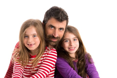Happy family beard father and two kid daughters blue eyes on white background